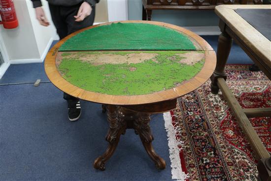 A Victorian walnut demi lune card table W.93cm